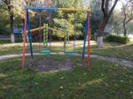 Children Playground, Swing Near The House  Stock Photo