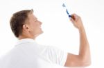 Male Looking At Toothbrush Stock Photo