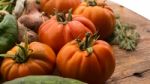 Several Vegetables On Wooden Chopping Board And Table Stock Photo