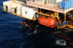 Life Boat Or Survival Craft At Muster Station Of Oil And Gas Drilling Rig Stock Photo