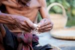 Old Men Are Wrapped A Cigarette Stock Photo