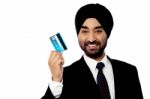 Happy Male Executive Holding Credit Card Stock Photo