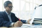 Senior Business Man Working On Office Table Stock Photo