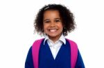 Beautiful Girl In Uniform With Backpack Smiling At You Stock Photo