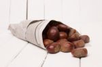 Sweet Chestnuts Wrapped In Newspaper Stock Photo