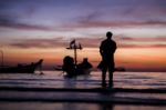 A Man Seeing The Beautiful Twilight Sunset Sky Stock Photo