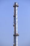 Industry Chimney Tube Against Clear Blue Sky Use For Industrial Stock Photo