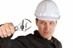 Handyman Wearing Uniform And Hardhat Stock Photo