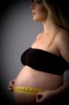 Pregnant Lady Measuring Her Tummy Stock Photo