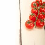 Fresh Cherry Tomatoes On A Cluster Stock Photo