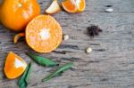 Mandarin Orange And Leaf On Wooden Background Stock Photo