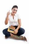 Female Student Showing Thump Up Stock Photo