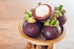 Group Of Mangoesteen On Wooden Tray Stock Photo