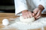 Man Kneading Dough, Closeup Shot Stock Photo