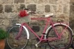 A Red And Pinky Bile In The Street ,n Front Of A Cafe Stock Photo