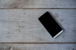 Phone On Wooden Floor Stock Photo