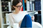 Young Worker Woman With Digital Tablet In Her Office Stock Photo