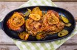 Delicious Baked Chicken Thighs With Lemon Slices, Onion And Zucchini Stock Photo