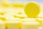 Pharmacy Theme, Heap Of Yellow Round Medicine Tablet Antibiotic Pills. Shallow Dof Stock Photo