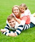 Lying Family In Outdoors Stock Photo