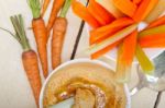 Fresh Hummus Dip With Raw Carrot And Celery Stock Photo