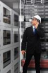 Programmer On Phone In Data Center Room Stock Photo