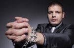 Businessman Struggles Against Chains Stock Photo