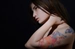 Beautiful Asian Woman With A Tattoo On Her Arm And Shoulder,dark Stock Photo