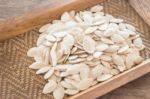 Pumpkin Seeds On Wooden Tray Stock Photo