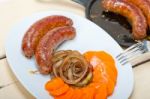 Beef Sausages Cooked On Iron Skillet Stock Photo