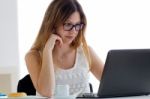 Pretty Young Woman Using Her Laptop At Home Stock Photo