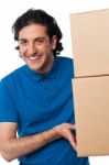 Man Carrying Couple Of Cardboard Boxes Stock Photo