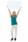 Woman Holding Ad Board Above Her Head Stock Photo