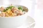 Pork Congee And Fried Garlic On Table Stock Photo