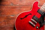 Electric Guitar On Wood Background Illuminated By Natural Daylight Stock Photo