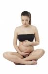 Woman Holding Her Pregnant Belly. White Background Stock Photo