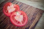 Half Cut Of Red Tomato In Heart Shape Stock Photo