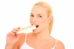 Woman Eating Nougat Stock Photo