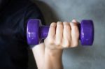 Woman Hand Holding Violet Dumbbell Stock Photo