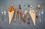 Concept For Homemade Various Nuts Ice Cream. Mixed Nuts In Waffl Stock Photo