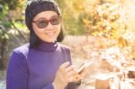 Asian Woman With Smiling Face Happiness Emotion And Smart Phone In Hand Use For People And Digital Technology Stock Photo