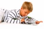 Little Boy Using Digital Tablet Stock Photo