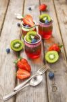 Red And Green Jelly Served With Fruit Stock Photo