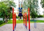 Young Man Is Practicing On A Horizontal Bar Stock Photo