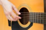 Guitarist Hand Playing Acoustic Guitar Stock Photo