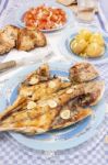 Grilled European Seabass With Potato And Tomato Salad Stock Photo