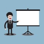 Businessman Reporting On Presentation Board Stock Photo