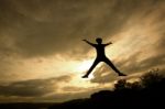 Silhouette Tourist Man Open Arm. He Is Happy In The Mountain. To Stock Photo