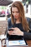 Young Woman Enjoying At Cafe Stock Photo