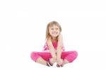 Smiling Girl Sitting On Floor Stock Photo